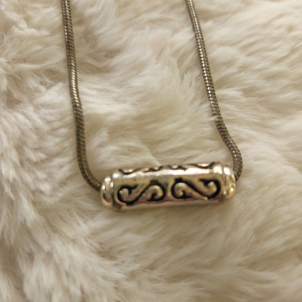 Simplistic Silver Necklace with Intricate Design